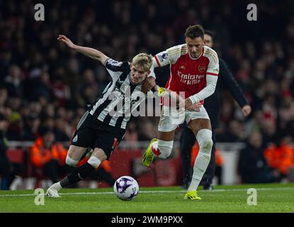(240225) -- LONDON, Feb. 25, 2024 (Xinhua) -- Newcastle United's Anthony Gordon (L) is challenged by Arsenal's Ben White during the English Premier League match between Arsenal and Newcastle United in London, Britain, Feb. 24, 2024. (Xinhua)FOR EDITORIAL USE ONLY. NOT FOR SALE FOR MARKETING OR ADVERTISING CAMPAIGNS. NO USE WITH UNAUTHORIZED AUDIO, VIDEO, DATA, FIXTURE LISTS, CLUB/LEAGUE LOGOS OR 'LIVE' SERVICES. ONLINE IN-MATCH USE LIMITED TO 45 IMAGES, NO VIDEO EMULATION. NO USE IN BETTING, GAMES OR SINGLE CLUB/LEAGUE/PLAYER PUBLICATIONS. Stock Photo