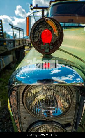 Broken turn signal lamp and headlights on an abandoned truck in a junkyard Stock Photo