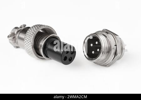 Plug and socket of an aviation cylindrical 4-pin connector GX12-4 on a light background. Stock Photo
