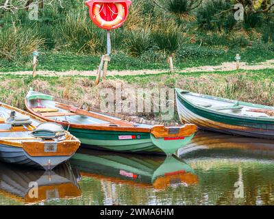 Moored boats on river in Killarney National Park, Ireland. High quality photo Stock Photo