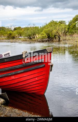 Moored boats on river in Killarney National Park, Ireland. High quality photo Stock Photo