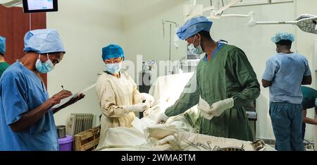 (240225) -- ADDIS ABABA, Feb. 25, 2024 (Xinhua) -- Liu Guangzhi (2nd L), a member of the 24th Chinese medical team dispatched to Ethiopia, conducts surgery for a patient with local doctors at the Tirunesh Beijing General Hospital in Addis Ababa, Ethiopia, May 23, 2023. The 24th Chinese medical team dispatched to Ethiopia departed from central China's Henan Province in April 2023. By early February 2024, the team has diagnosed for 15,000 plus patients, offered 562 surgeries and treated 6,631 people with traditional Chinese medical treatment. (The 24th Chinese medical team dispatched to Ethiopia Stock Photo