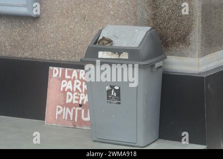 Gray bins are placed on the ground to create a clean environment without trash. Stock Photo