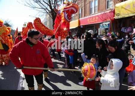 New York, USA. 24th Feb, 2024. People perform dragon dance and lion dance during a Lantern Festival parade in New York, the United States, Feb. 24, 2024. TO GO WITH 'Roundup: New Yorkers wrap up Lunar New Year celebrations with big parades' Credit: Liu Yanan/Xinhua/Alamy Live News Stock Photo