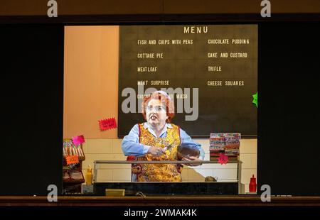 Rebecca Evans (Despina) in COSI FAN TUTTE at Welsh National Opera (WNO), Wales Millennium Centre, Cardiff, Wales  24/02/2024  music: Mozart  libretto: da Ponte  conductor: Tomas Hanus  design: Jemima Robinson  lighting: Mark Jonathan  movement: Michael Spenceley  director: Max Hoehn Stock Photo