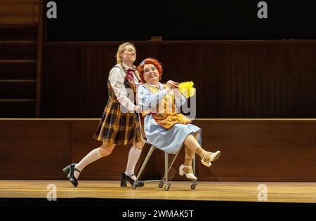 l-r: Sophie Bevan (Fiordiligi), Rebecca Evans (Despina) in COSI FAN TUTTE at Welsh National Opera (WNO), Wales Millennium Centre, Cardiff, Wales  24/02/2024  music: Mozart  libretto: da Ponte  conductor: Tomas Hanus  design: Jemima Robinson  lighting: Mark Jonathan  director: Max Hoehn Stock Photo