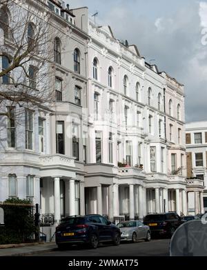 Attractive buildings, Notting Hill, Royal Borough of Kensington and Chelsea; London, UK.  White stucco covering.  Victorian style; five floors; Stock Photo