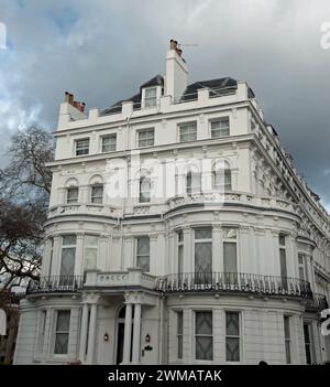 Attractive buildings, Notting Hill, Royal Borough of Kensington and Chelsea; London, UK.  White stucco covering.  Victorian style; five floors. Stock Photo