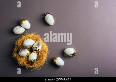 Basket with Easter eggs on dark gray background. Easter concept. Top view, flat lay, copy space. Stock Photo