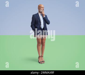 Corporate businessman portrait cropped and matched with female legs, he is thinking with hand on chin, creative collage Stock Photo