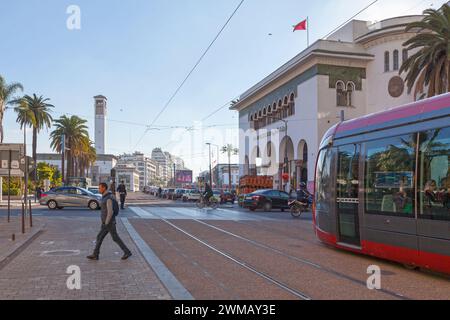 Casablanca, Morocco - January 17 2019: Tramway passing by the Post office on Mohammed V Square toward the clock tower of the City hall. Stock Photo