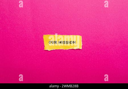 Our mission words written on yellow torn paper with pink background. Conceptual business symbol. Copy space. Stock Photo