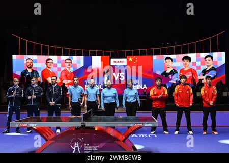 Busan, South Korea. 25th Feb, 2024. Team China (R) and team France (L) line up prior to the men's team final match between China and France at the ITTF World Team Table Tennis Championships Finals Busan 2024 in Busan, South Korea, Feb. 25, 2024. Credit: Tao Xiyi/Xinhua/Alamy Live News Stock Photo