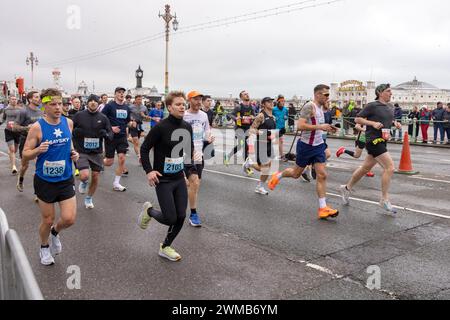 Kings Road, Brighton, City of Brighton & Hove, East Sussex, UK. The runners on this years Brighton Half Marathon under a cloudy sky and low temperature along Brighton & Hove seafront. 25th February 2024. David Smith/Alamy Live News Stock Photo