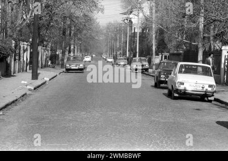 Bucharest, Romania, approx. 1979. Vehicles parked along a street on downtown Bucharest. Stock Photo