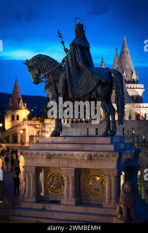 Saint Stephen's equestrian statue in the heart of Buda Castle, between Fisherman's Bastion and Matthias Church in the evening Stock Photo