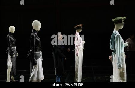 Milan, Italy. 23rd Feb, 2024. People view creations of Prada women's Fall/Winter 2024 collections at Prada's re-see event during Milan Fashion Week in Milan, Italy, Feb. 23, 2024. Credit: Li Jing/Xinhua/Alamy Live News Stock Photo