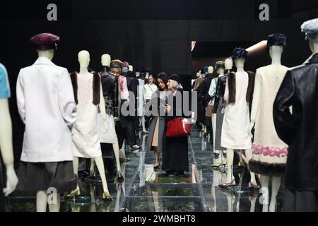 Milan, Italy. 23rd Feb, 2024. People view creations of Prada women's Fall/Winter 2024 collections at Prada's re-see event during Milan Fashion Week in Milan, Italy, Feb. 23, 2024. Credit: Li Jing/Xinhua/Alamy Live News Stock Photo