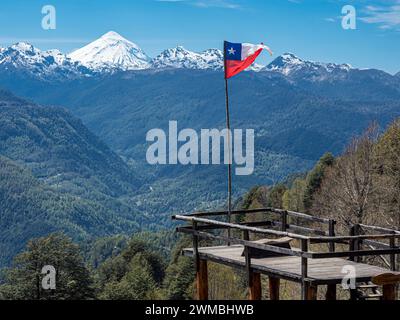 Viewpoint at trail to heart-shaped lake Laguna Corazon, chilenean flag, near Liquine, Chile Stock Photo