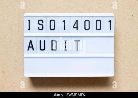 Lightbox with word ISO 14001 audit on wood background Stock Photo