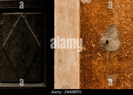 Wall and wooden door fragment backgroun Stock Photo
