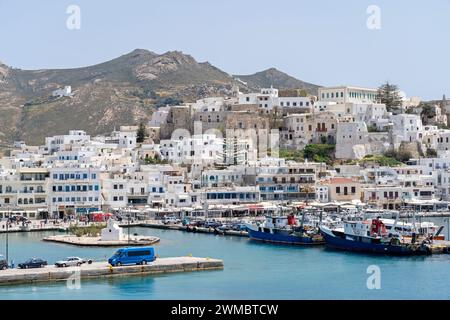 Port of Naxos island, in Cyclades, Greece, Europe. This is Chora, the capital town of Naxos, with the medieval castle atop the settlement. Stock Photo