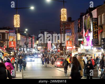 View of Camden High Street at night still busy with shoppers and tourists in London UK Stock Photo