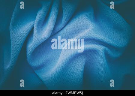 A crumpled blue fabric background. Close up. Stock Photo