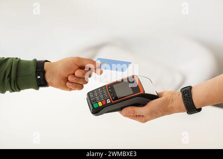 Cropped of man using credit card while making contactless payment Stock Photo