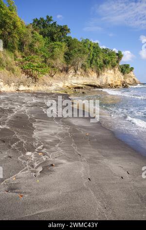 Beautiful rugged Balenbouche Beach - the sand is black due to basalt particles from past volcanic activity in the area (Saint Lucia, West Indies) Stock Photo