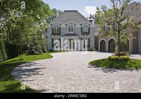 Large French Manor style natural stone home with three car garage and ...