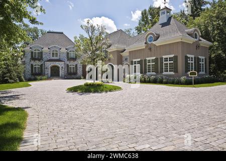 Large French Manor style natural stone home with three car garage and ...
