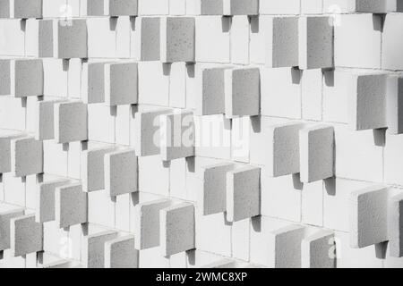 Mid-century modern exterior block wall pattern and texture with shadows Stock Photo