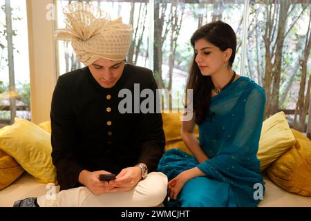 Two Guests at a traditional Indian wedding, Mumbai, Maharashtra, India Stock Photo