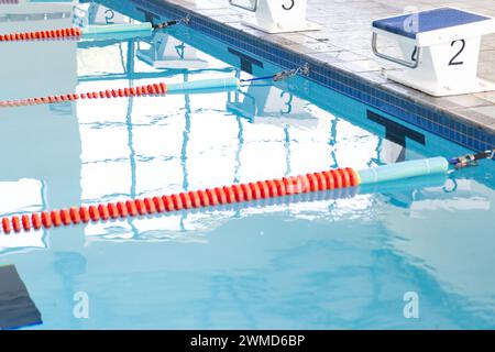 Swimming lanes await competitors at a clean indoor pool Stock Photo