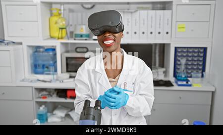 African american woman scientist conducting medical research in lab, using cutting-edge virtual reality glasses for a dynamic video call Stock Photo