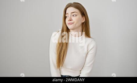 Young woman with gaze of contempt on a white background Stock Photo - Alamy