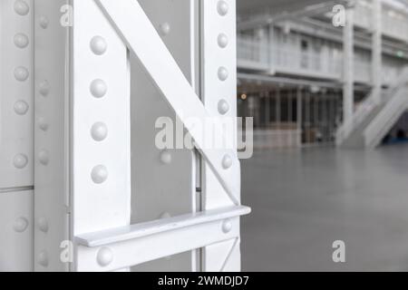 White steel truss pillar structure, close up photo, vintage industrial architecture details Stock Photo