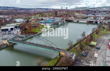 Drone point of  view on  lower  Schlossgarten of Stuttgart and pedestrian bridge Berger Steg  over River Neckar  and distant Konig-Karles bridge Stock Photo