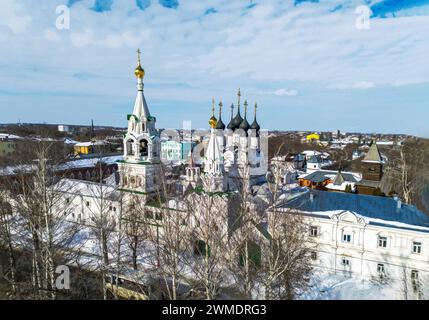 Drone point of view Holy Trinity Convent in sunny winter day in Murom town.   Many Christian institutions on the Oka River. Inside also Wooden buildin Stock Photo