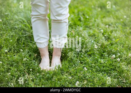 Summer time. Closeup on woman in the meadow outdoors. Stock Photo