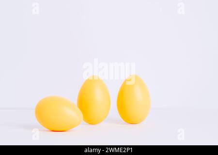 Three painted Easter eggs on white background. Easter holiday concept. Stock Photo
