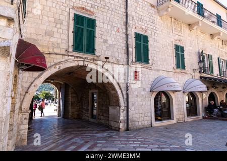 Kotor, Montenegro - FEB 14, 2024: Trg od Oruzja, Arms Square is the main square in Kotor, Montenegro, hosting several stores, banks, cafes, and import Stock Photo