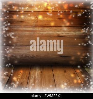 Christmas rustic background - vintage planked wood with lights and free text space.Old wooden boards and falling snow. Winter. New Year. Stock Photo
