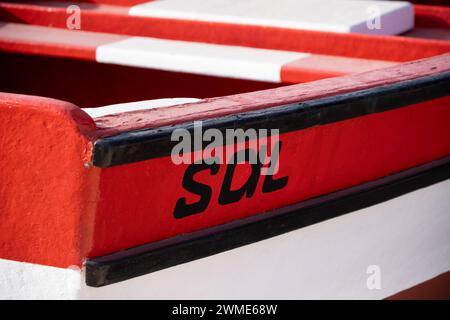 Red and White Fishing Boat Detail with Sal painted on the Hull, Santa Maria, Sal, Cape Verde Islands, Africa Stock Photo