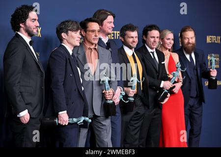 Los Angeles, United States. 24th Feb, 2024. (L-R) Benny Safdie, Cillian Murphy, Robert Downey Jr., Josh Hartnett, Alden Ehrenreich, Casey Affleck, Emily Blunt and Kenneth Branagh appears backstage after winning the award for Outstanding Performance by a Cast in a Motion Picture award for 'Oppenheimer' during the 30th annual SAG Awards at the Shrine Auditorium and Expo Hall in Los Angeles, California on Saturday, February 24, 2024. Photo by Chris Chew/UPI Credit: UPI/Alamy Live News Stock Photo