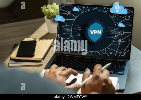 VPN Security Network with man using a laptop protection private network Stock Photo