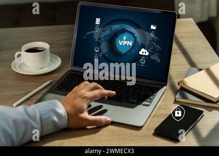 VPN Security Network with man using a laptop protection private network Stock Photo