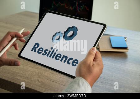 Resilience business and A Standard Quality resilience in organization  young man working on his laptop Stock Photo