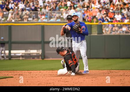 Chicago Cubs second baseman David Bone (13) turns a double play in the